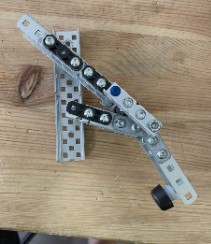 A VEX metal clamp arm built to lock a mobile goal in place